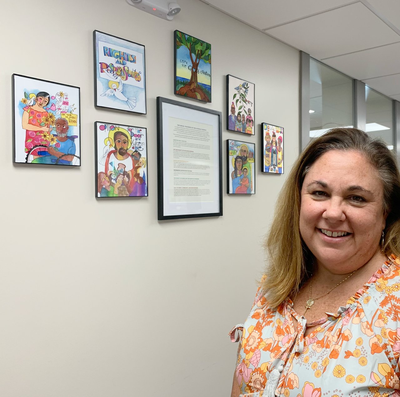 Lori Stoll, Food Programs Coordinator at Catholic Charities of Central and Northern Missouri, brought Brother Mark McGrath’s seven prints depicting Catholic Social Teachings to the waiting area of the central offices at 1015 Edmonds Street, to serve as a reminder that participating in the work of Catholic Charities is a participation in the ministry of Christ.